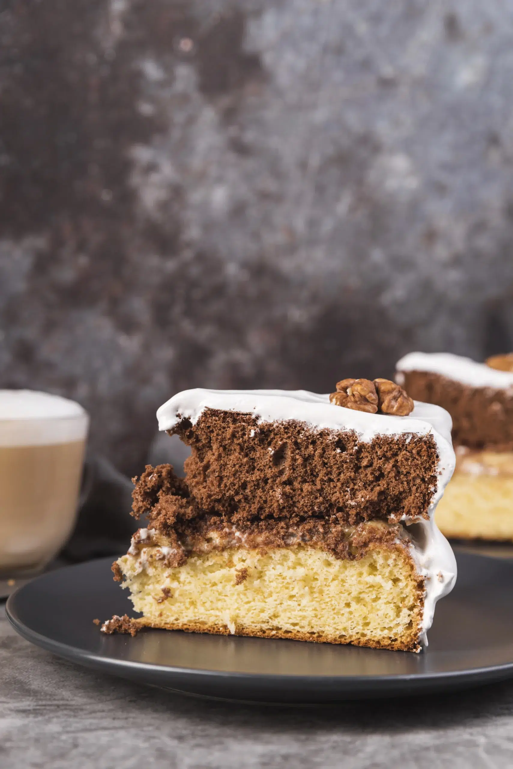 Moist cinnamon coffee cake slice with buttery crumb streusel topping on a white plate